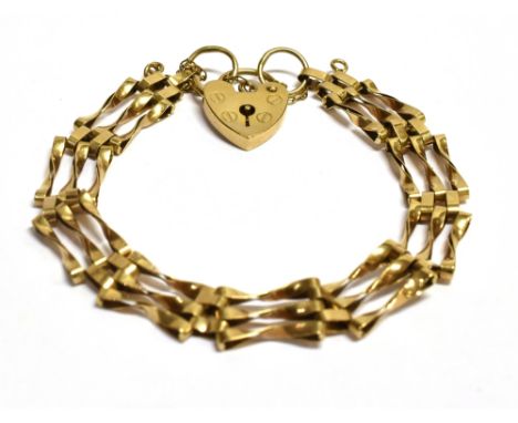 A 9CT GOLD VINTAGE HEART PADLOCK THREE GATE BRACELET  The bracelet measuring approx. 16cm in length, weight approx. 7.3g.