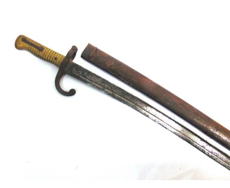 MILITARIA - A GERMAN-MADE FRENCH M1866 'CHASSEPOT' YATAGHAN SWORD BAYONET  the 57cm steel blade unmarked to the back-edge, an