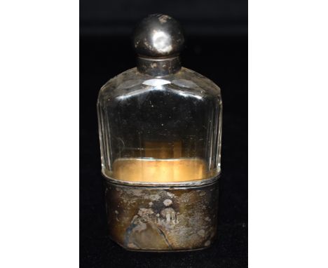 A VICTORIAN SILVER TOP AND SILVER BASE RIBBED GLASS HIP FLASK hallmarked for London 1877 with monogrammed initials to the bas