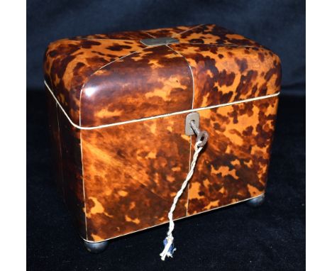 A 19TH CENTURY BLONDE TORTOISESHELL TWIN DIVISION TEA CADDY  on bun feet, 18cm wide 11cm deep 16cm high Condition Report : go