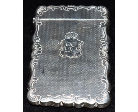 A VICTORIAN SILVER CARD CASE  with wavy edges and border, engine patterned body and monogrammed cartouche, hallmarked for Bir