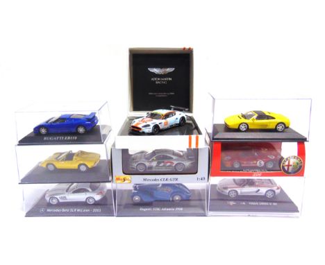 NINE 1/43 SCALE DIECAST MODEL CARS  each mint or near mint and boxed (Gulf Aston Martin box lid lacking lining).