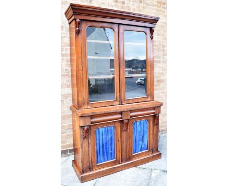 VICTORIAN MAHOGANY BOOKCASE CABINET the upper section having a cornice above twin glazed doors with three adjustable shelves 