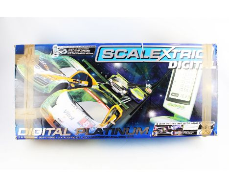 A 'Scalextric Digital Platinum' slot car racing set. Five cars (one missing), comprising two Porsche 997, two Lamborghini Gal
