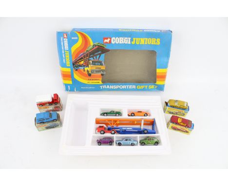 Four vintage Matchbox diecast cars and a Corgi Juniors 3025 Transporter Gift Set. The cars comprising a Matchbox 14 Petrol Ta