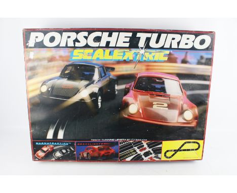 Scalextric Porsche GT 'Turbo Charge Motors' set. Containing cars, track, controllers, and power supply, in the original box 