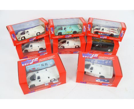 Eight Vitesse diecast models of Porsche 956 racing cars. 1:43 scale, with assorted advertising logos, in the original boxes