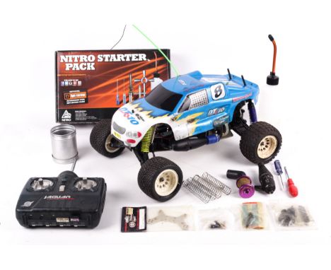 A Thunder Tiger SSK 1/10 4WD 2WD Stadium Truck. With controller and manual, in the original box