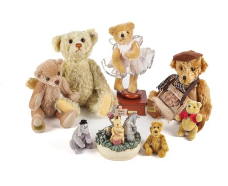 A collection of assorted teddy bears and Winnie the Pooh collectables. Including a Steiff #660955 British Collectors Bear, 37