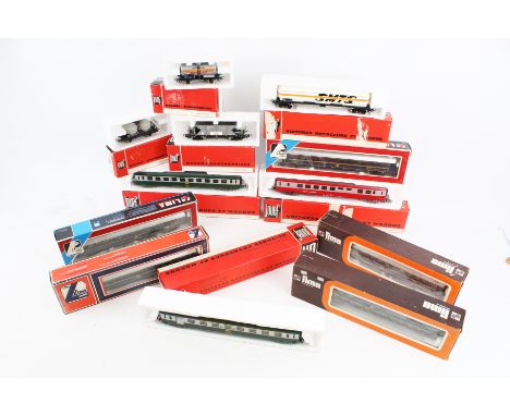 Twelve Lima OO gauge coaches and wagons. Including a 309336 French carriage, etc, all in the original boxes
