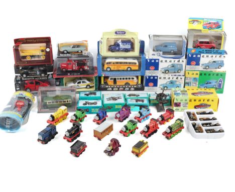 A collection of assorted diecast model cars and Thomas the Tank engine trains. Including Vanguards, Lledo, etc. Some in the o