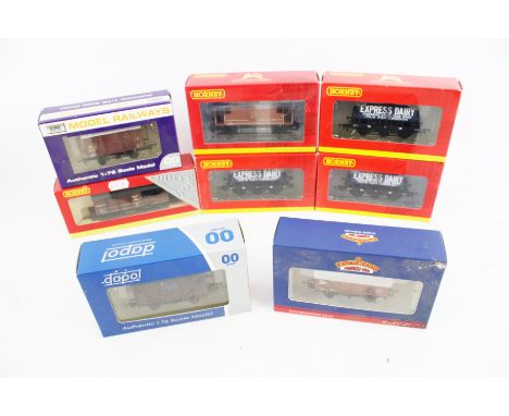 Eight OO gauge wagons. Comprising five Hornby, two Dapol, and one Bachmann, in the original boxes