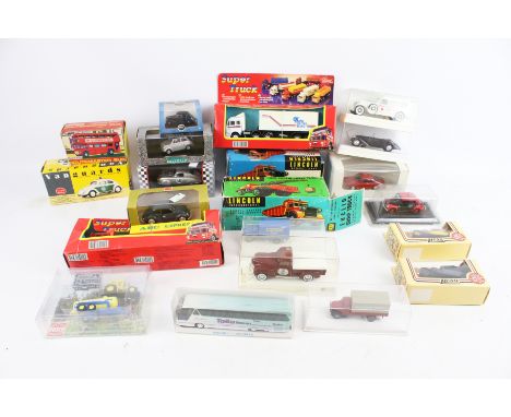 An assortment of diecast. Including Solido cars, two Lincoln International battery operated trucks, a Lone Star Routemaster b