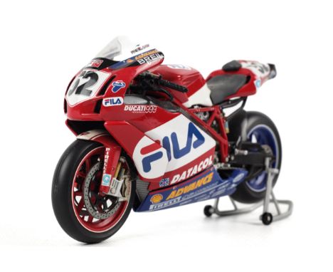 A Minichamps diecast Ducati 999F04 2004 motorcycle. 1:12 scale, in the original box 