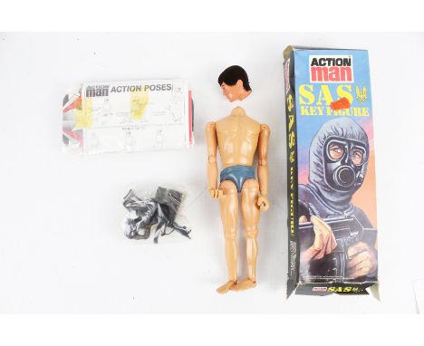 A Palitoy Action Man SAS Key Figure. With action grip hands and eagle eyes, stamped 1978. Boxed with combat suit, flak jacket