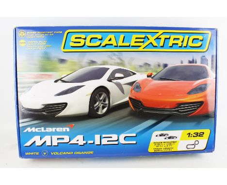A Scalextric McLaren MP4-12C set. Containing cars, track, controllers, etc. in the original box