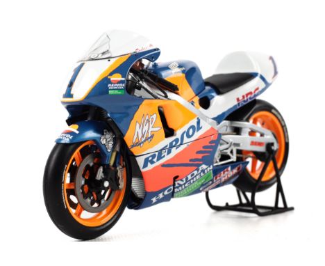 A Minichamps diecast model of a Honda NSR500. M Doohan 1997 in 1:12 scale, in the original box