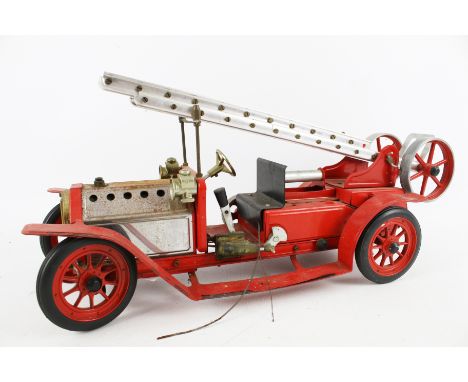 A vintage Mamod live steam fire engine. Modelled as an Edwardian machine, L45cm