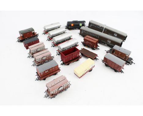 A collection of OO gauge model railway wagons. Including a Bauchmann fuel tanker, a Lima 'Palethorpes' wagon, etc.