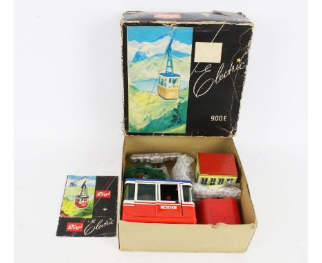 A vintage Lehmann tinpplate 900E electric cable car. In the original box with components and an instruction manual