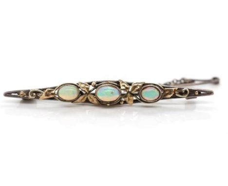 Australian Arts &amp; Crafts opal and silver brooch by Rhoda Wager.1917-1946. With applied gilt highlights and applied mark t