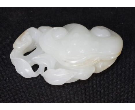 Chinese carved Xinjiang He-Tran amulet (diameter 8.5cm approx).