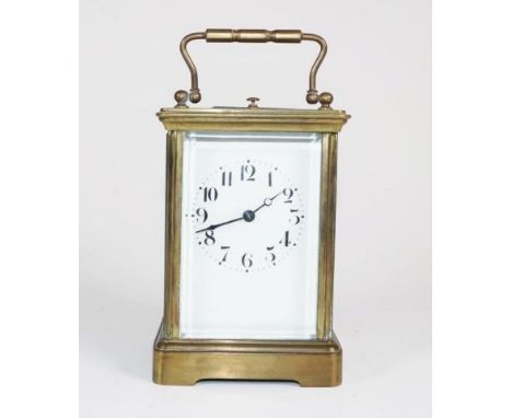 French brass carriage striking repeater clock. bevelled glass,  Marked Made in France to movement. 13.2cm high (not including