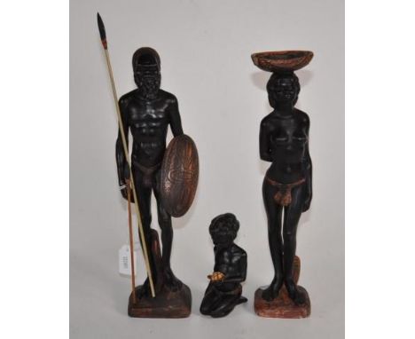 Group three Australian Aborigine ceramic figures including standing man, and woman, with kneeling child, inscribed Pieter van
