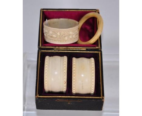 Pair of cased ivory napkin rings together with a Chinese ivory napkin ring &amp; another, This item cannot be exported.