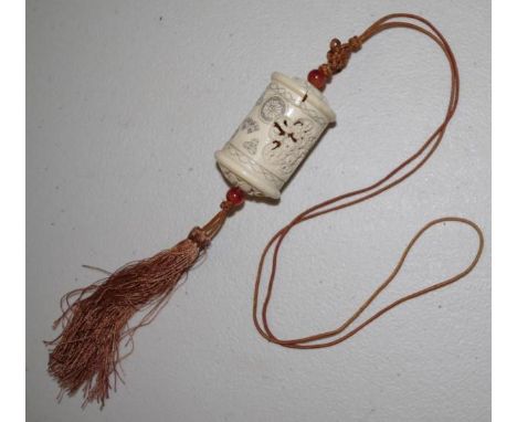 Carved Japanese okimono 6cm high, with cord and tassle attached