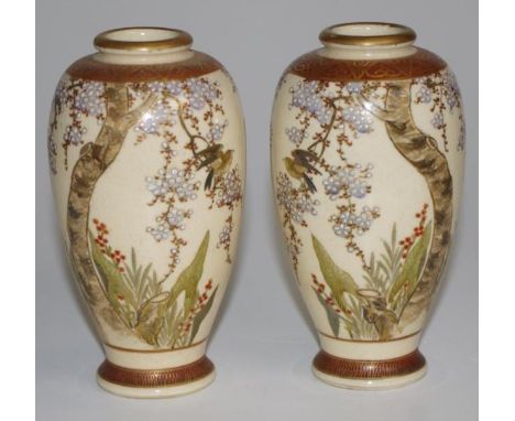 Pair Japanese Satsuma vases each with bird and blossom decoration, red character mark to bases, (height 13cm approx, each).