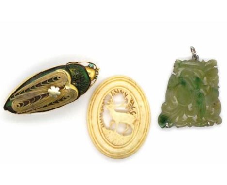 Art Deco bug brooch and a carved jade pendant as well as a carved piece of stag antler. The jade is modern oriental carving o