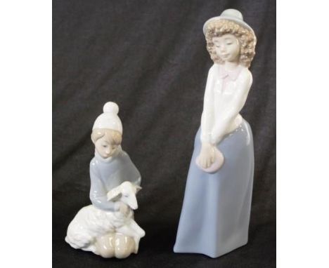 Lladro figure of girl with lamb togther with a Nao figure of a girl