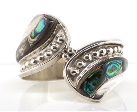 Abalone shell set silver bangle marked 950 Mexico. With spring hinge. Approx weight 54 grams, inside width 62mm closed