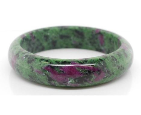 A large ruby in Zoisite bangle approx inside diameter 62mm x width 16mm x 8.5mm d shape gauge