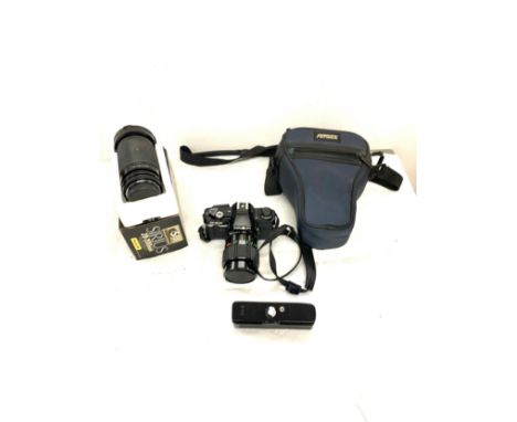 Minolta X300  35MM SLR camera with lenses, Minolta automatic winder, Sirius 28-200mm camera lense, carry case, untested 