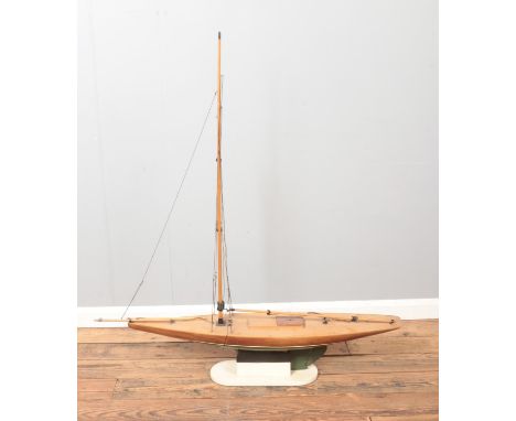 A large vintage motorised kit model of a pond yacht on display stand. Approx. dimensions 115cm x 128cm (including stand).  Ma