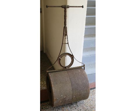 An iron garden roller.  