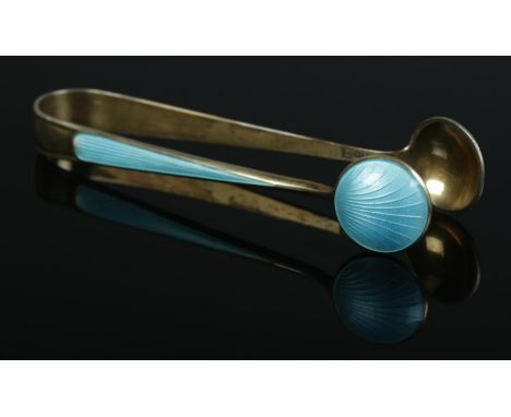 A pair of Norwegian silver and guilloche enamel sugar tongs, with T shield mark for NM Thune.  