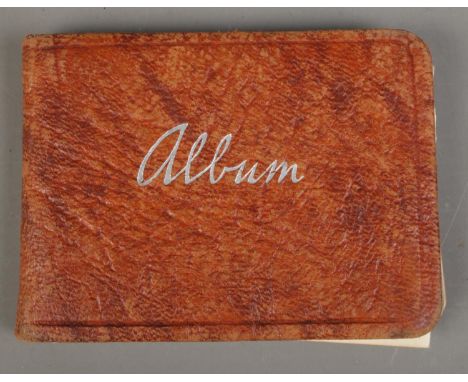 A vintage autograph album containing a collection of signatures, including examples for singers Dickie Valentine, Michael Hol