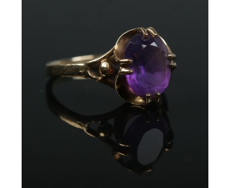 A 9ct gold and amethyst claw set ring. Size M. 2.3g  