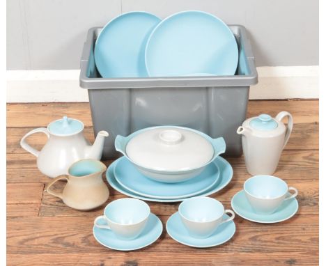 A quantity of Poole dinner wares in 'duck egg' blue and white. To include plates, teapot, cups and saucers and lidded tureen.