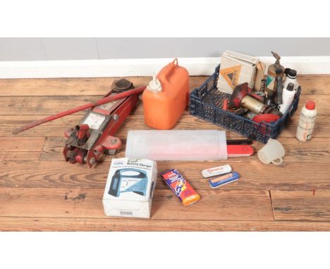 A collection of auto tools, spares and repairs to include battery charge, Draper jack, exhaust repair kit, reflective safety 