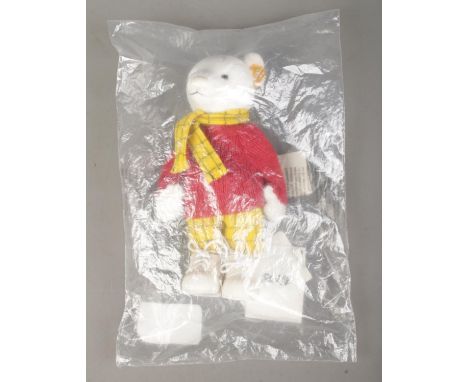 A Steiff Rupert Bear; 653551, in white, still in plastic packing bag. With yellow tag and button in ear.  