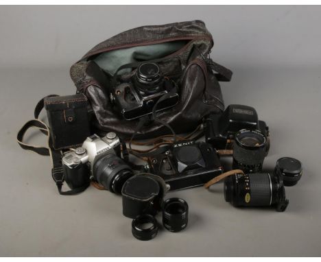 A selection of vintage cameras including a Pentax MZ-M, Zenit 12XP, Yashica together with several vintage lenses and light gu