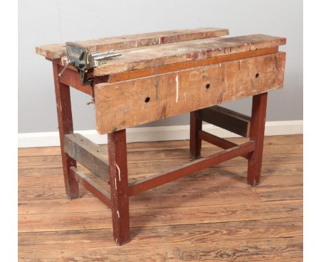 A vintage wooden work bench with Rabone Chesterman vice fitted.  