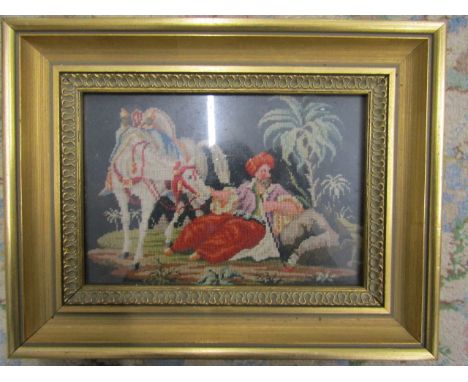 An Arabian scene tapestry framed and glazed 28x22cm