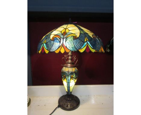 A tiffany style table lamp with illuminating body. In good condition. 62cmH shade 45cm dia
