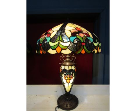 A Tiffany style table lamp with illuminating body&nbsp; (one piece of glass missing from shade as pictured) otherwise in good