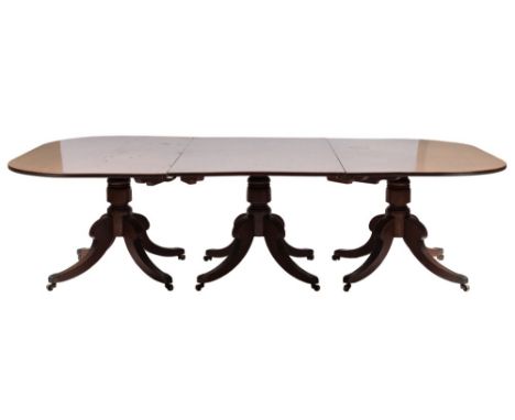 A Regency mahogany three pillar D end dining table:, the top with a reeded edge, on triple turned column supports and quadrup